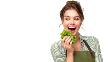 Cheerful woman eating lettuce leaf
