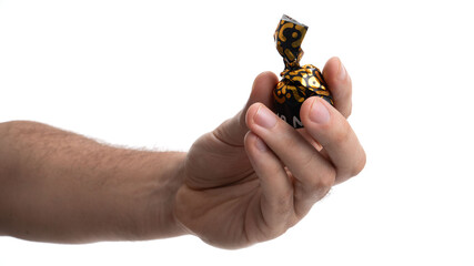 Delightful chocolate treat held in hand, showcasing vibrant packaging and craftsmanship