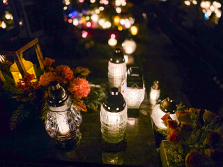 Traditional Polish cemetery on All Saints’ Day, glowing with countless candles at night. A moving cultural and spiritual tradition captured in vivid light and color.