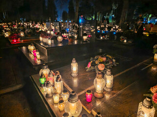Traditional Polish cemetery on All Saints&rsquo; Day, glowing with countless candles at night. A moving cultural and spiritual tradition captured in vivid light and color.