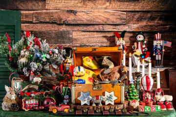 maximalist Christmas with retro suitcase filled with vintage toys surrounded with classic Christmas decorations