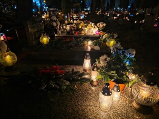 Traditional Polish cemetery on All Saints&rsquo; Day, glowing with countless candles at night. A moving cultural and spiritual tradition captured in vivid light and color.