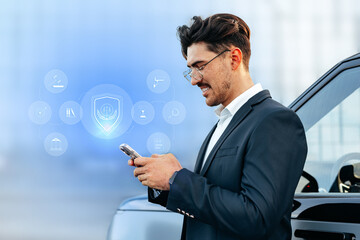 Person using smartphone while standing next to a car in a modern setting