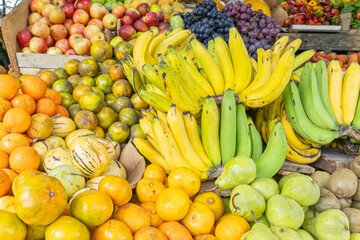 Colorful display of fresh fruits at the Otavalo market, Ecuador. A vibrant scene that conveys freshness, abundance, and natural flavor.