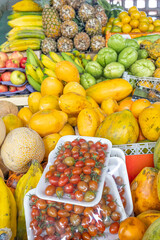 Colorful display of fresh fruits at the Otavalo market, Ecuador. A vibrant scene that conveys freshness, abundance, and natural flavor.