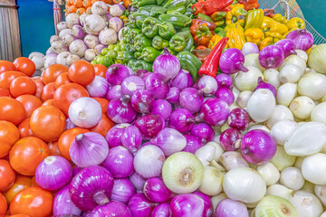 Colorful display of fresh vegetables at the Otavalo market, one of the largest and most traditional markets in Ecuador.