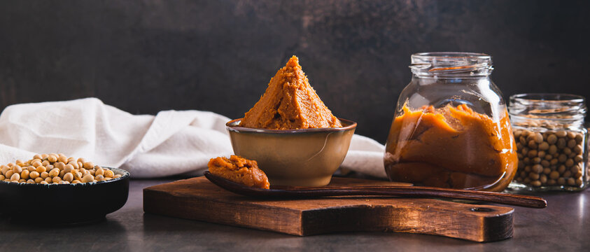 Asian miso paste in a brown bowl on the table web banner