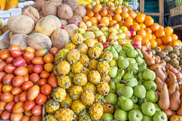 Colorful display of fresh fruits at the Otavalo market, Ecuador. A vibrant scene that conveys freshness, abundance, and natural flavor.