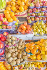 Colorful display of fresh fruits at the Otavalo market, Ecuador. A vibrant scene that conveys freshness, abundance, and natural flavor.