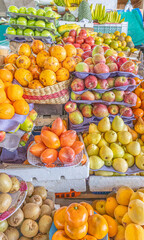 Colorful display of fresh fruits at the Otavalo market, Ecuador. A vibrant scene that conveys freshness, abundance, and natural flavor.