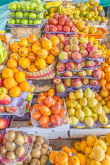 Colorful display of fresh fruits at the Otavalo market, Ecuador. A vibrant scene that conveys freshness, abundance, and natural flavor.