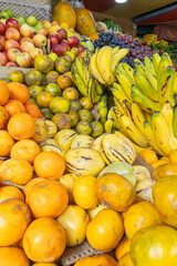 Colorful display of fresh fruits at the Otavalo market, Ecuador. A vibrant scene that conveys freshness, abundance, and natural flavor.