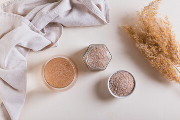 A glass of water and psyllium husk on the table for health  top view