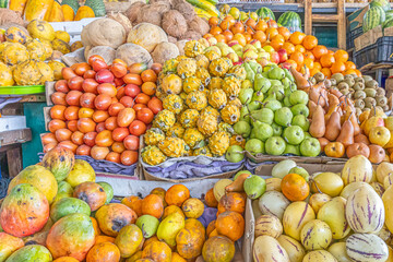 Colorful display of fresh fruits at the Otavalo market, Ecuador. A vibrant scene that conveys freshness, abundance, and natural flavor.