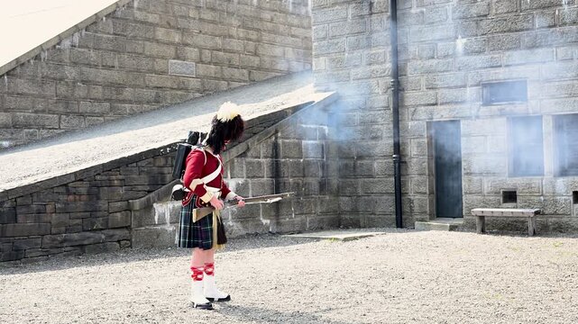 Highlander soldier firing a rifle