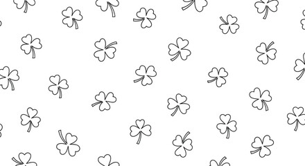Delicate seamless pattern of scattered shamrock leaves, symbolizing luck, nature, and the festive spirit of St. Patrick's Day.