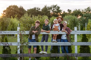 Fotobehang Sportwinkel Farmer family portrait. Prents with three kids.  © Halfpoint