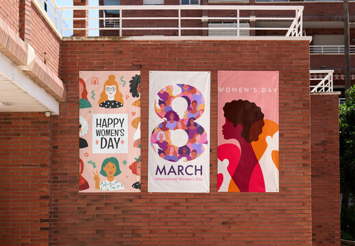 Mockup of Three empty poster frames mounted on a brick wall in an urban area ready for design.
