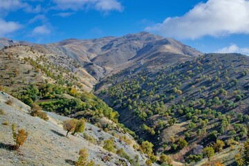 A wide-angle view of dry, rugged Zagros foothills in Kurdistan