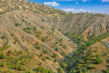 A wide-angle view of dry, rugged Zagros foothills in Kurdistan