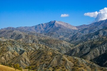 A wide-angle view of dry, rugged Zagros foothills in Kurdistan