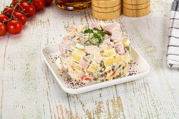 Russian traditional Olivier salad with sausages