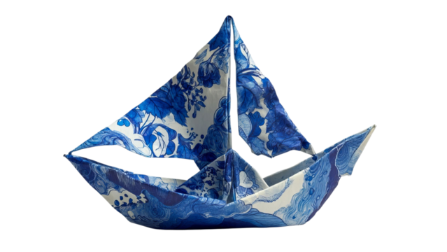 PNG of An elegant blue and white paper sailboat crafted with artistic floral patterns, symbolizing creativity and imagination.
