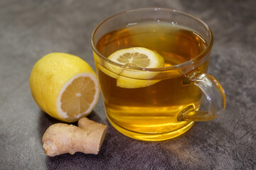 Cup of tea with lemon and ginger wellness and cold treatment