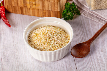 Raw dry sesame seeds heap