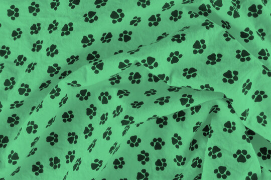 Green fleece blanket with white paw print pattern