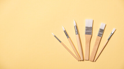 Collection of new paintbrushes of various sizes and styles for painting, crafting, art projects, and detailed hobby work. Tools of artist. New brush set. Drawing tassel variety. High quality photo.