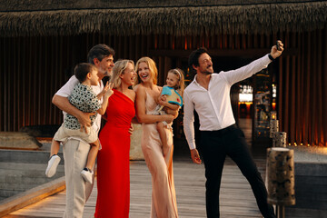 Family enjoying a celebratory moment captured on vacation at a resort destination