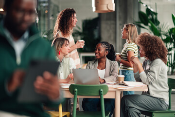Diverse young business people collaborating in modern office