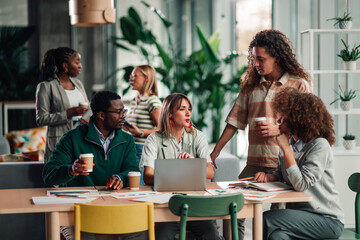 Diverse business team collaborating in modern office space
