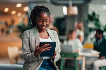 African american businesswoman using digital tablet in modern office