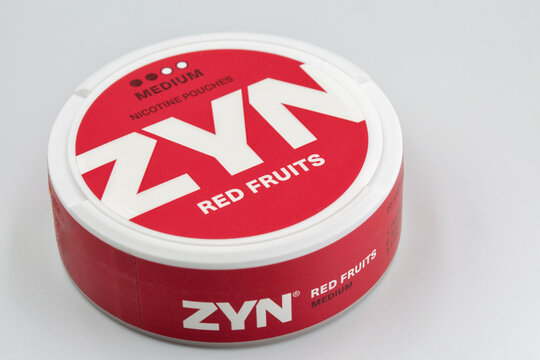 ZYN nicotine pouches red fruits medium strength container closeup.