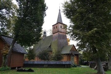 Naklejka premium Historic wooden church of the Holy Trinity and St. Anthony the Abbot in Lopuszna, Poland. Church is part of Wooden Architecture Trail in Malopolska.