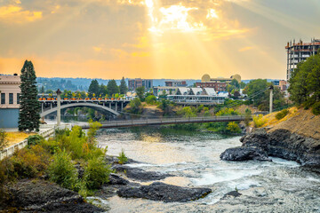 Spokane cityscape buildings and Spokane river at golden sunrise