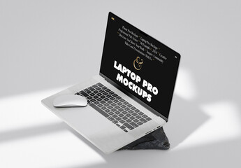 Laptop With The Mouse On Stone Mockup