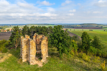 Explore the ancient ruins of the Chapel of the Exaltation of the Holy Cross in Bristev. The remnants rise amid lush greenery and pastoral fields, showcasing a blend of history and nature.