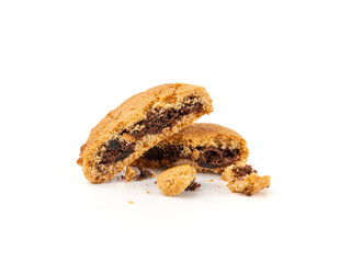 Crumbled chocolate cookies with chocolate filling isolated, brown round biscuits pieces