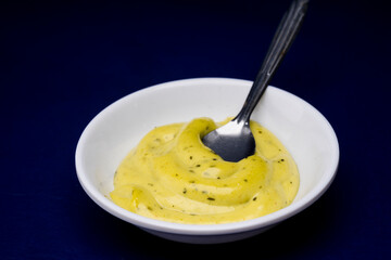 Guacamole sauce on blue background