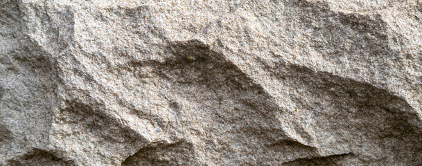 Natural gray stone surface with layered texture close-up