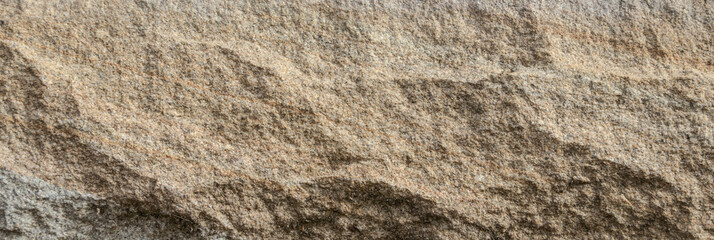 Natural gray stone surface with layered texture close-up