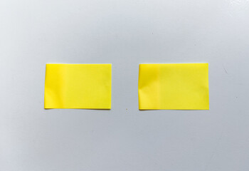 Isolated minimalist setup with two parallel yellow sticky notes on white background. Ideal for business planning, project management, and idea prototyping.