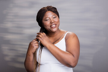 African american skincare model with a glossy complexion and fresh skin, embracing body positivity and self acceptance. Wellness and cosmetics advertisement celebrating self love.