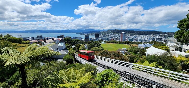 Wellington, New Zealand - 22 January 2025: Wellington Cable Car and City View in Daylight. New Zealand Urban Landscape and Nature Integration. The partly cloudy sky adds depth and contrast.