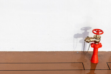 Red Fire Brigade Water Tap on Ship Deck – Fire Safety Equipment Background