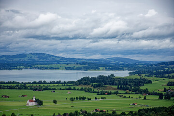 A cloudy autumn day near a castle at the foot of the Alps.