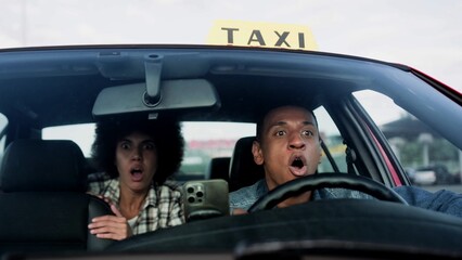 African American taxi driver and female passenger getting into accident on the road. People, job, lifestyle concept. © Vlad